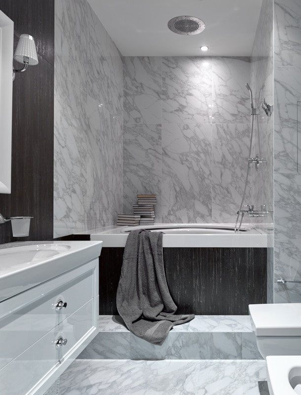 This is an example of a mid-sized contemporary master bathroom in Moscow with raised-panel cabinets, white cabinets, an undermount tub, a wall-mount toilet, white tile, porcelain tile, white walls, porcelain floors, a drop-in sink, white floor, a single vanity and a floating vanity.