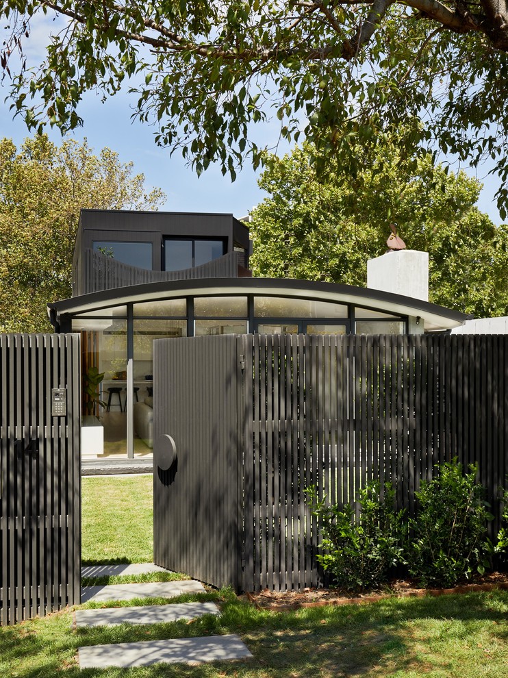 Contemporary front yard garden in Melbourne with a garden path.
