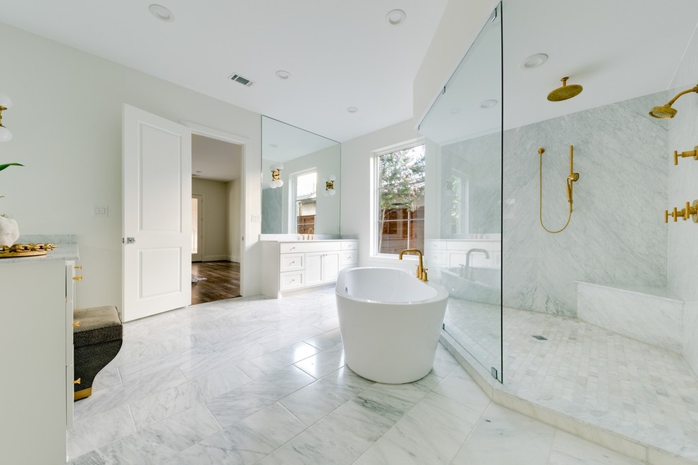Mid-sized contemporary master bathroom in Chicago with recessed-panel cabinets, white cabinets, a freestanding tub, a corner shower, a one-piece toilet, white tile, marble, white walls, marble floors, a drop-in sink, grey floor, a hinged shower door and grey benchtops.