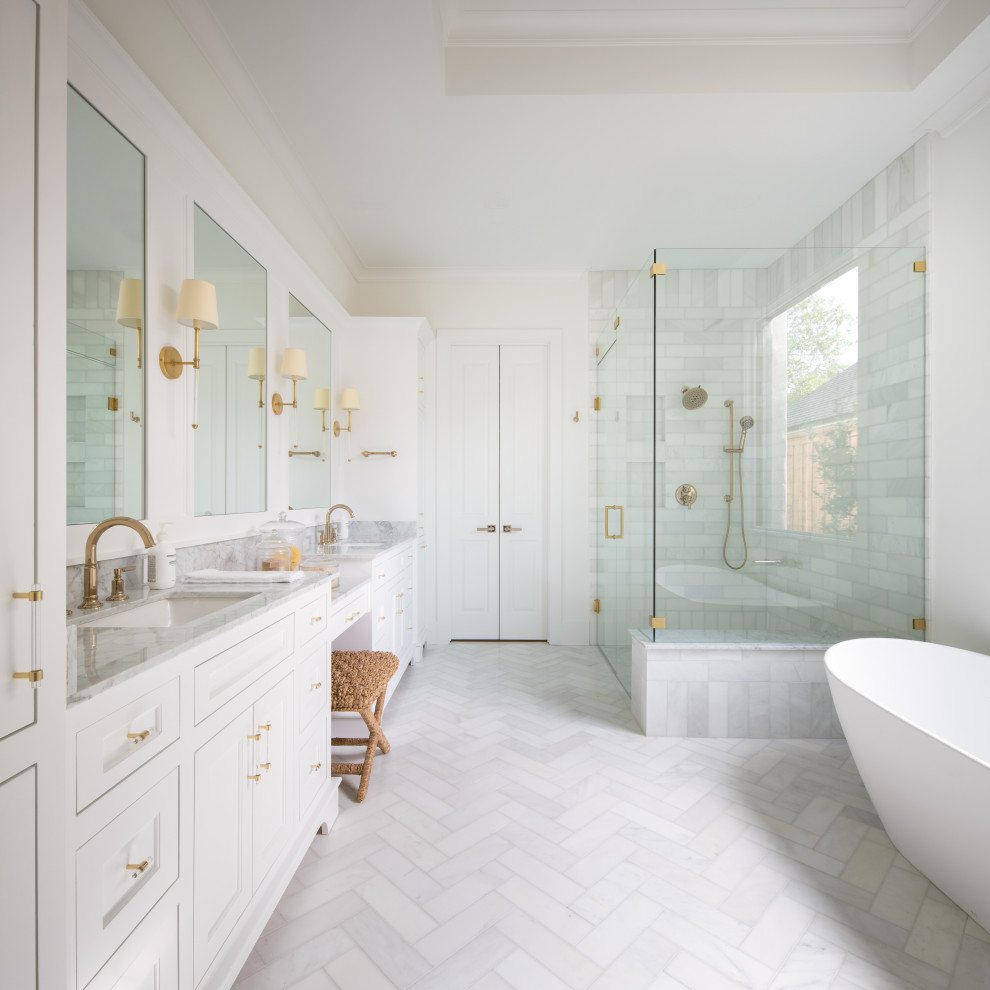 Photo of a large traditional ensuite bathroom in Dallas with freestanding cabinets, light wood cabinets, an alcove bath, a shower/bath combination, a one-piece toilet, white tiles, marble tiles, white walls, marble flooring, a submerged sink, marble worktops, white floors, a shower curtain, white worktops, a shower bench, a single sink, a built in vanity unit and a coffered ceiling.