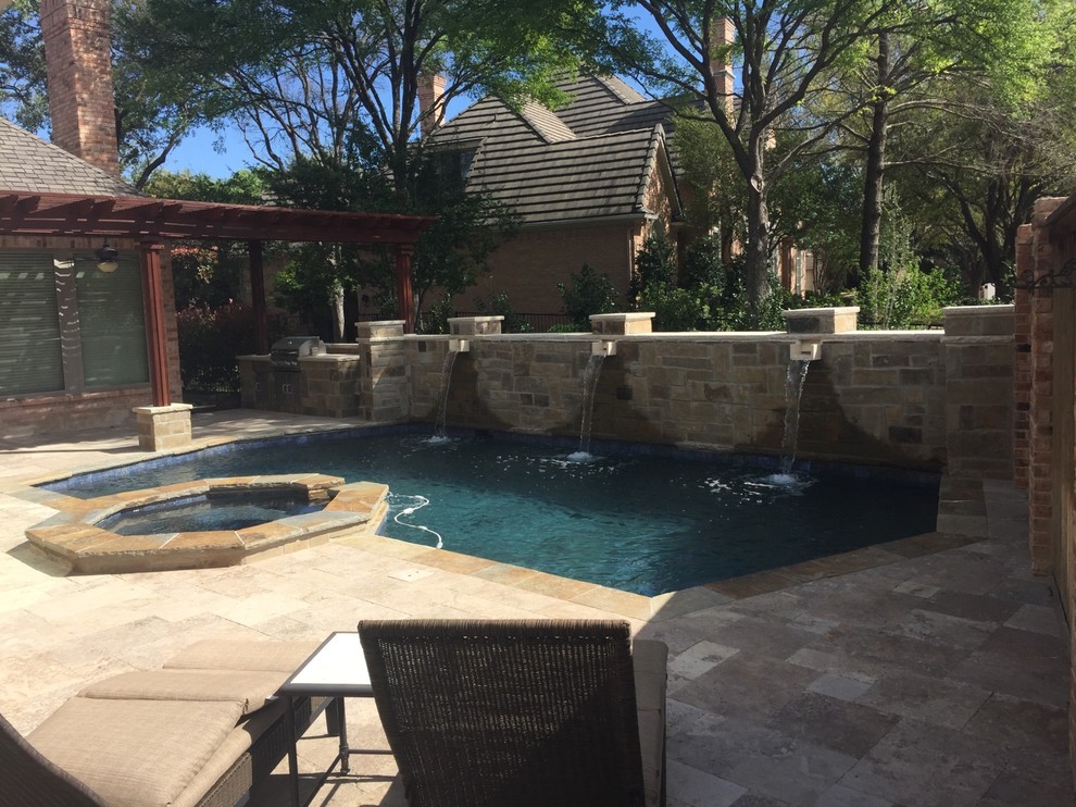 Example of a mid-sized mountain style backyard stone and rectangular natural hot tub design in Orange County