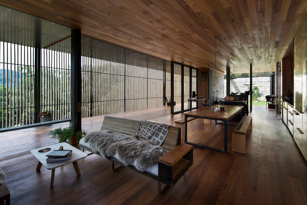 This is an example of a large contemporary open concept living room in Melbourne with medium hardwood floors.