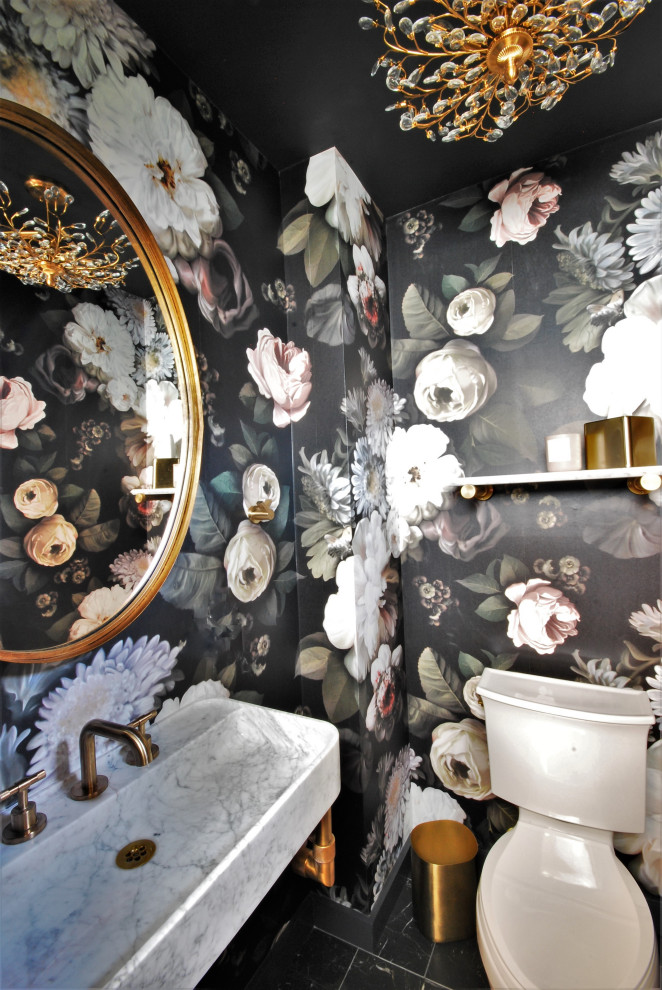 Inspiration for a small classic cloakroom in Philadelphia with white cabinets, a two-piece toilet, black walls, porcelain flooring, an integrated sink, marble worktops, black floors, white worktops, a floating vanity unit and wallpapered walls.