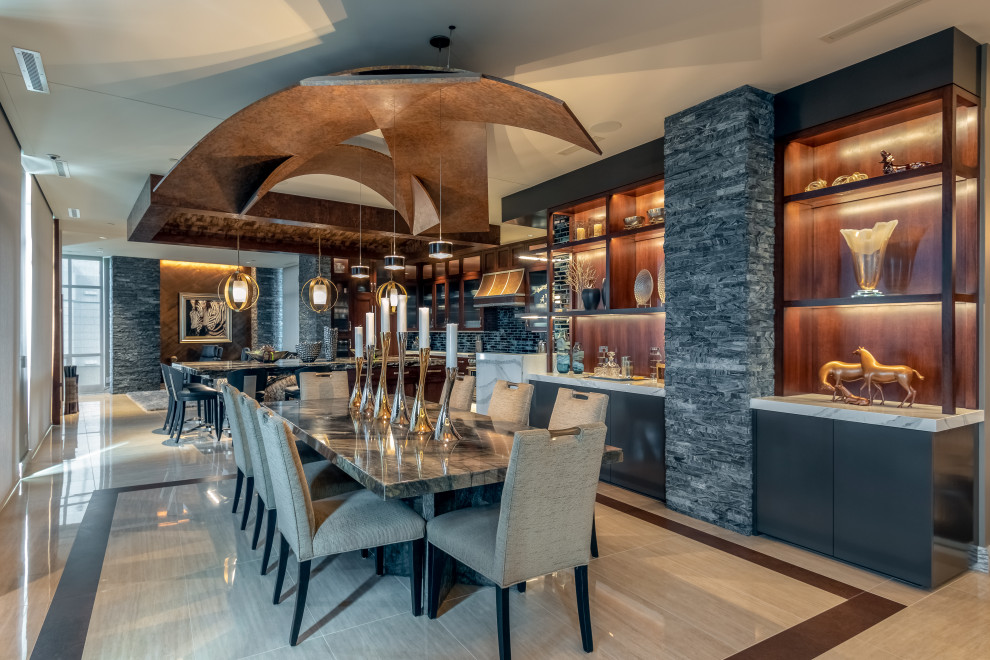 This is an example of a large contemporary kitchen/dining room in Omaha with beige walls, porcelain flooring, a stacked stone fireplace surround, beige floors and a wood ceiling.