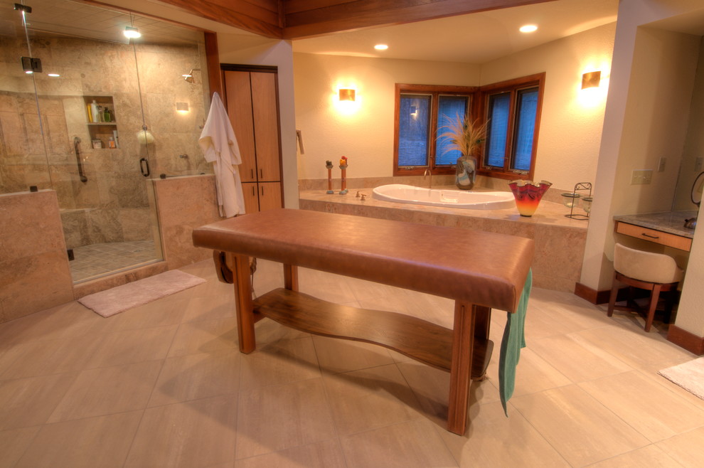 This is an example of an expansive contemporary bathroom in Albuquerque with flat-panel cabinets, light wood cabinets, a drop-in tub, a double shower, porcelain floors, an undermount sink, granite benchtops and a hinged shower door.