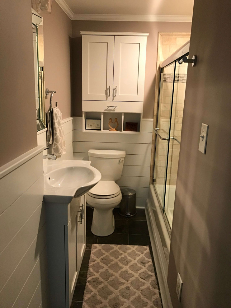 Design ideas for a small transitional 3/4 bathroom in DC Metro with recessed-panel cabinets, white cabinets, an undermount tub, a shower/bathtub combo, a one-piece toilet, beige tile, travertine, beige walls, slate floors, a console sink, glass benchtops, brown floor, a sliding shower screen, white benchtops, a niche, a single vanity, a built-in vanity and panelled walls.