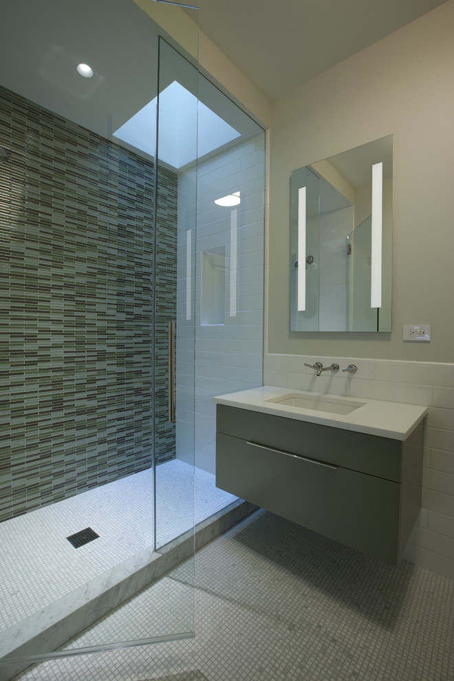 Inspiration for a large contemporary 3/4 bathroom in Chicago with mosaic tile, flat-panel cabinets, grey cabinets, an alcove shower, green tile, mosaic tile floors, an undermount sink, engineered quartz benchtops and beige walls.