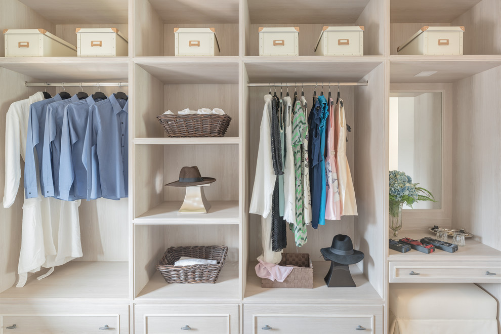 Design ideas for a contemporary gender-neutral built-in wardrobe in London with open cabinets.
