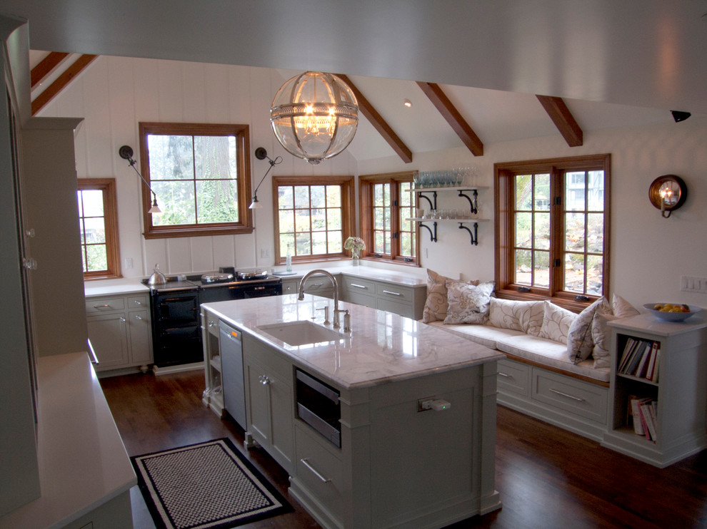 Inspiration for a traditional u-shaped kitchen in Portland with an undermount sink, white cabinets and marble benchtops.