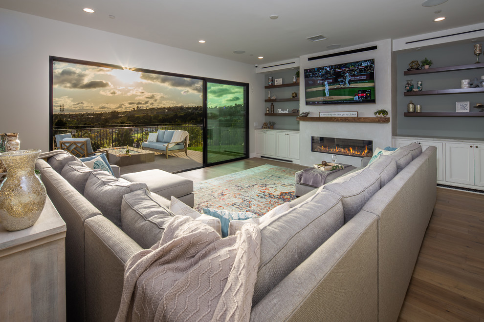 This is an example of a large beach style family room in San Diego.