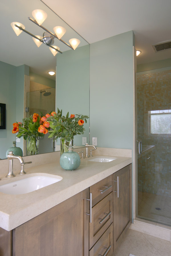 Small traditional master bathroom in San Francisco with an undermount sink, flat-panel cabinets, medium wood cabinets, engineered quartz benchtops, an alcove shower, beige tile, mosaic tile, green walls and ceramic floors.