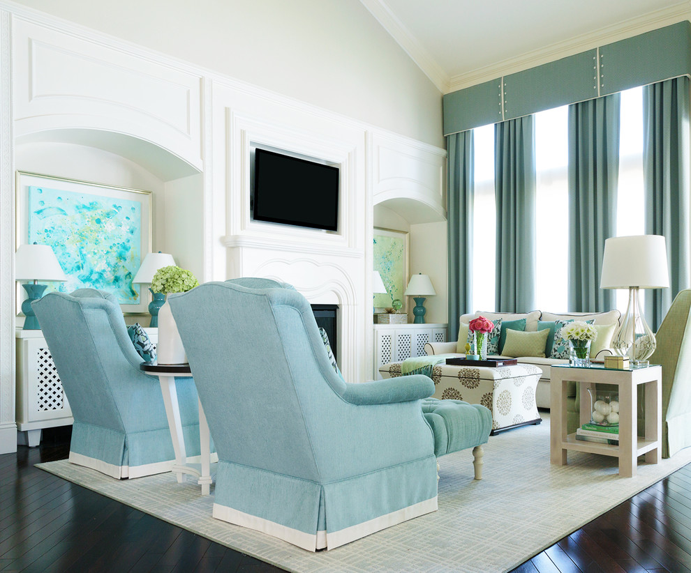 The Davis Home - Family Room - Design with the family in mind with Crypton upholstery fabric and indoor/outdoor fabrics. Custom media wall made to fit the TV and add a very finished look. Blue drapery with tailored cornice and custom sized broadloom rug.