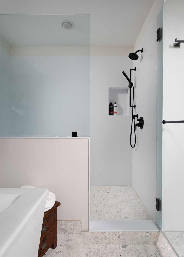 Inspiration for a large contemporary ensuite bathroom in Kansas City with flat-panel cabinets, black cabinets, a freestanding bath, an alcove shower, terrazzo flooring, engineered stone worktops, white floors, a hinged door, white worktops, a shower bench, double sinks and a built in vanity unit.