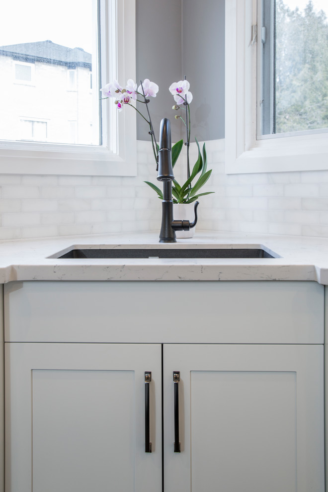 Example of a transitional kitchen design in Toronto