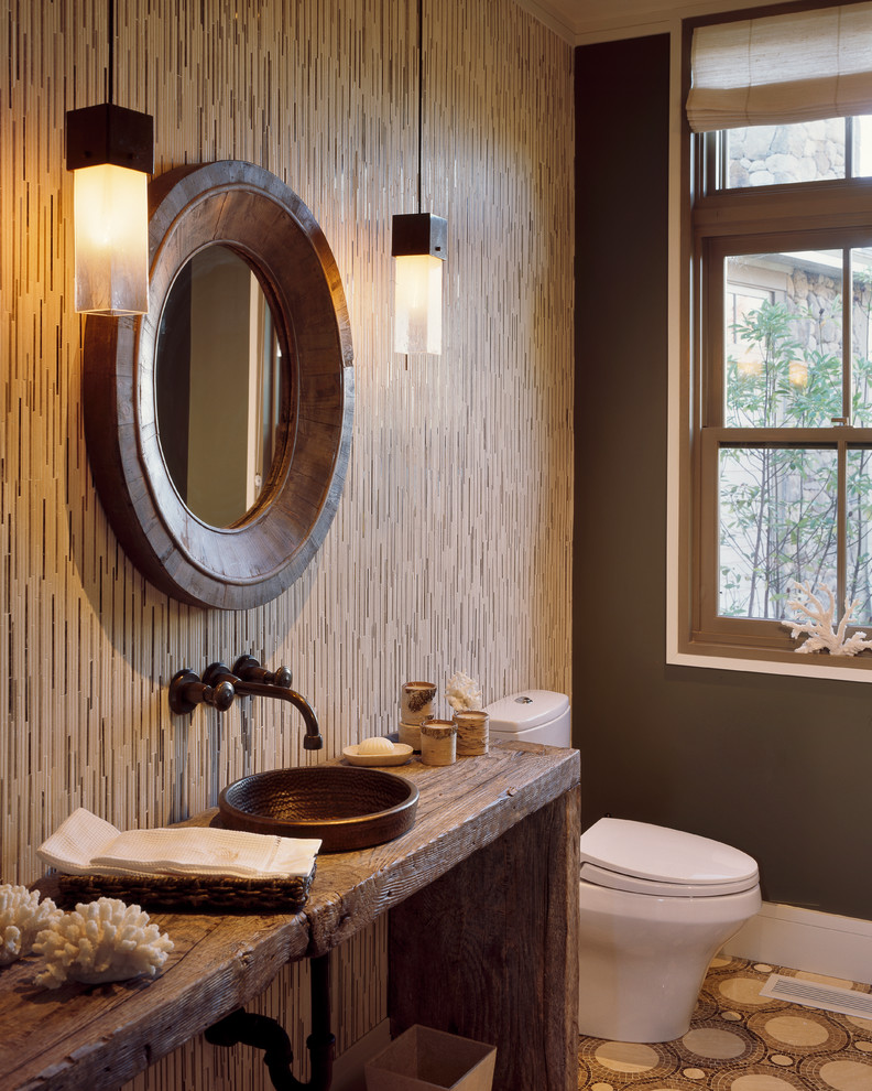 Photo of a transitional bathroom in Boston with a vessel sink and brown walls.