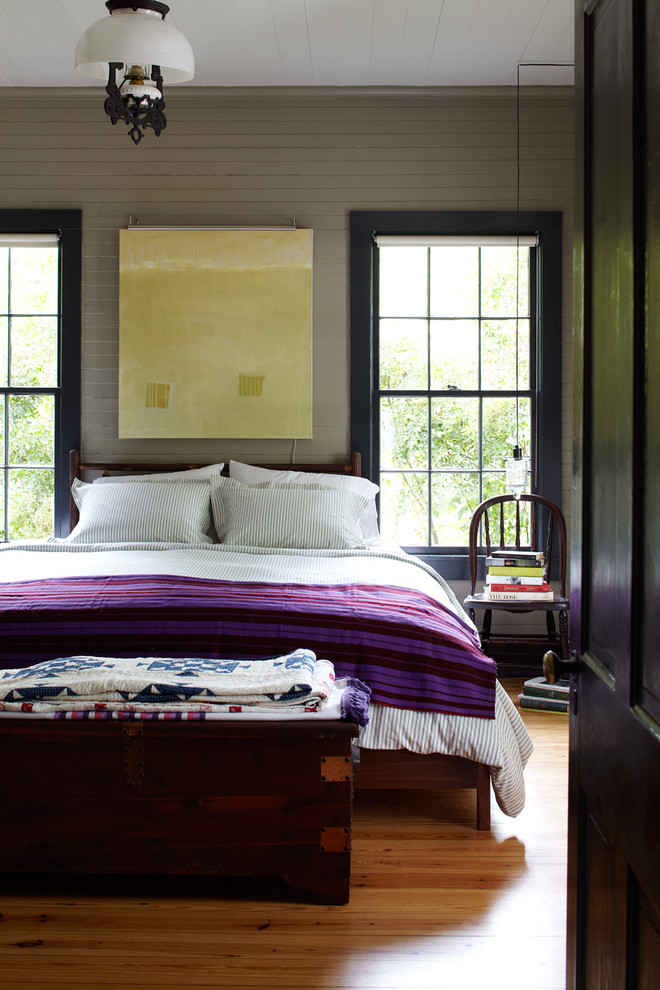 Design ideas for a country bedroom in Austin with green walls.