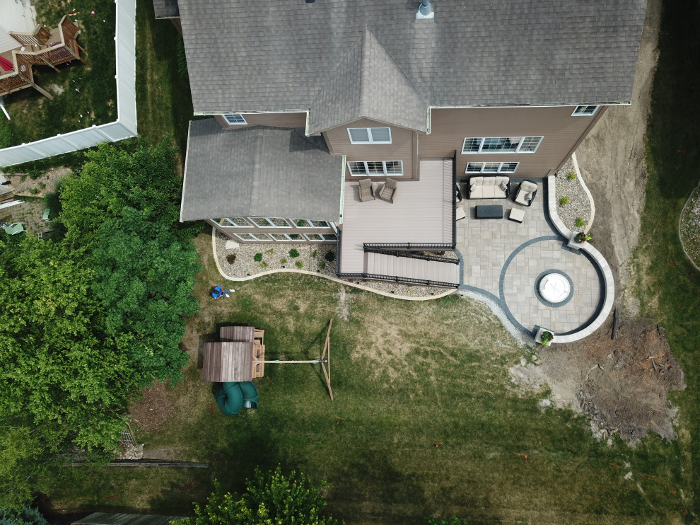 Example of a mid-sized backyard second story metal railing deck design with no cover