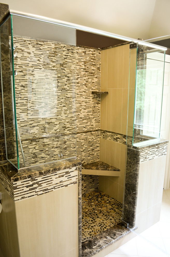 Alcove shower - large transitional master brown tile and mosaic tile ceramic tile alcove shower idea in Boston with recessed-panel cabinets, dark wood cabinets, a two-piece toilet, brown walls, an undermount sink and granite countertops