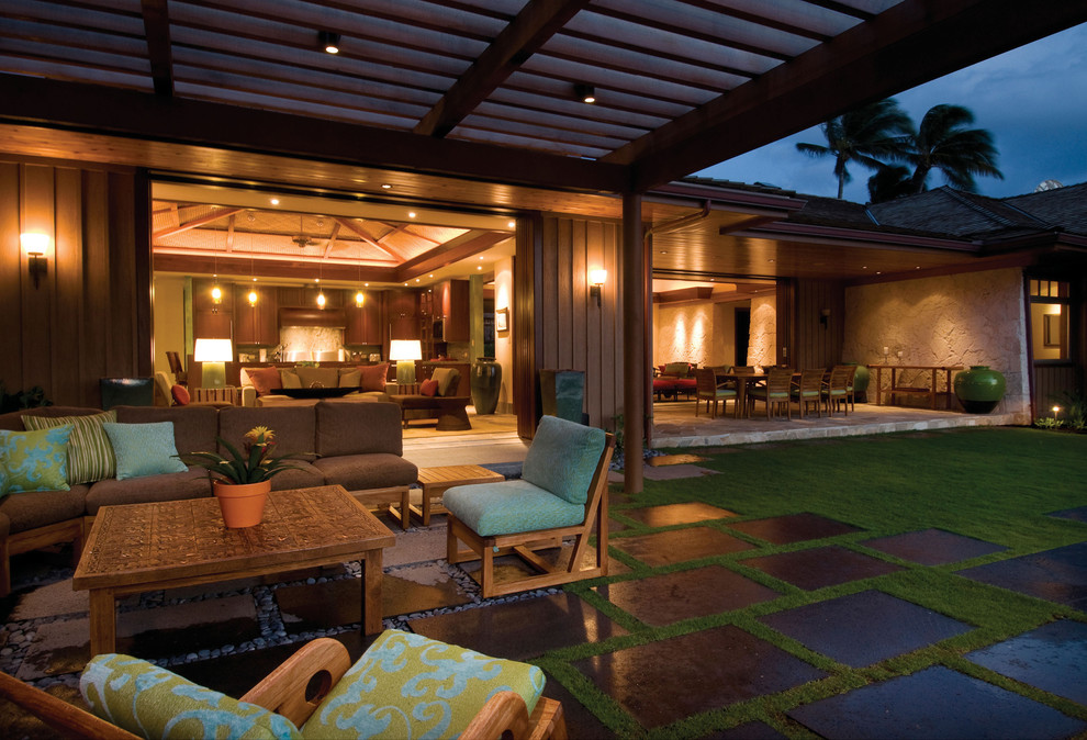 This is an example of a tropical patio in Hawaii with a pergola.