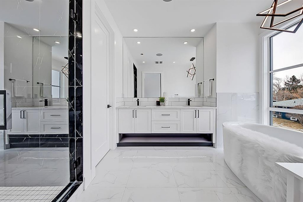 Example of a transitional home design design in Calgary