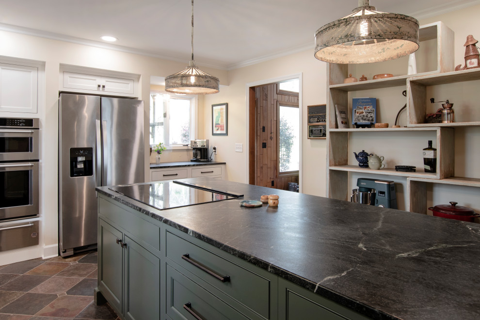 Mid-sized country l-shaped separate kitchen in Nashville with a farmhouse sink, beaded inset cabinets, green cabinets, soapstone benchtops, white splashback, ceramic splashback, stainless steel appliances, slate floors, with island, multi-coloured floor and black benchtop.