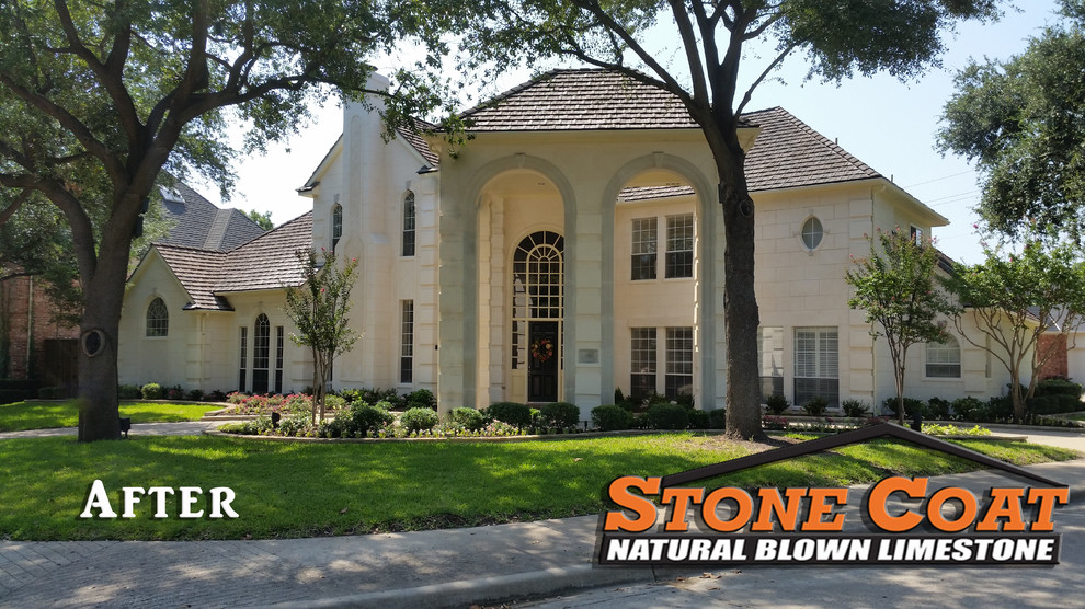 This is an example of a large modern two-storey white house exterior in Dallas with stone veneer.