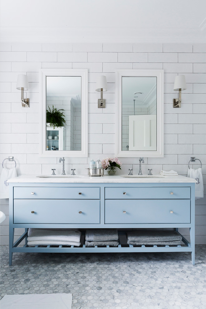 Traditional master bathroom in Sydney with blue cabinets, white walls, marble floors, an undermount sink, marble benchtops, white tile, subway tile and beaded inset cabinets.