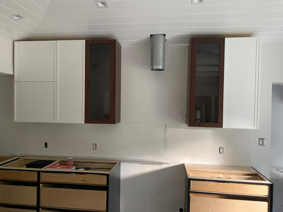 Hardware ideas for mismatched kitchen upper cabinets?