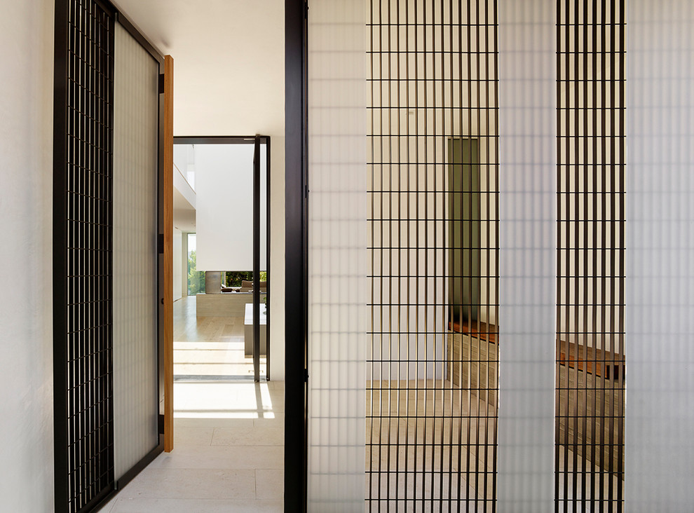 Example of a minimalist porcelain tile and beige floor hallway design in San Francisco with white walls
