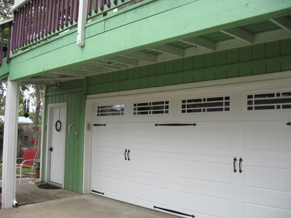 Photo of a mid-sized beach style attached two-car garage in Austin.