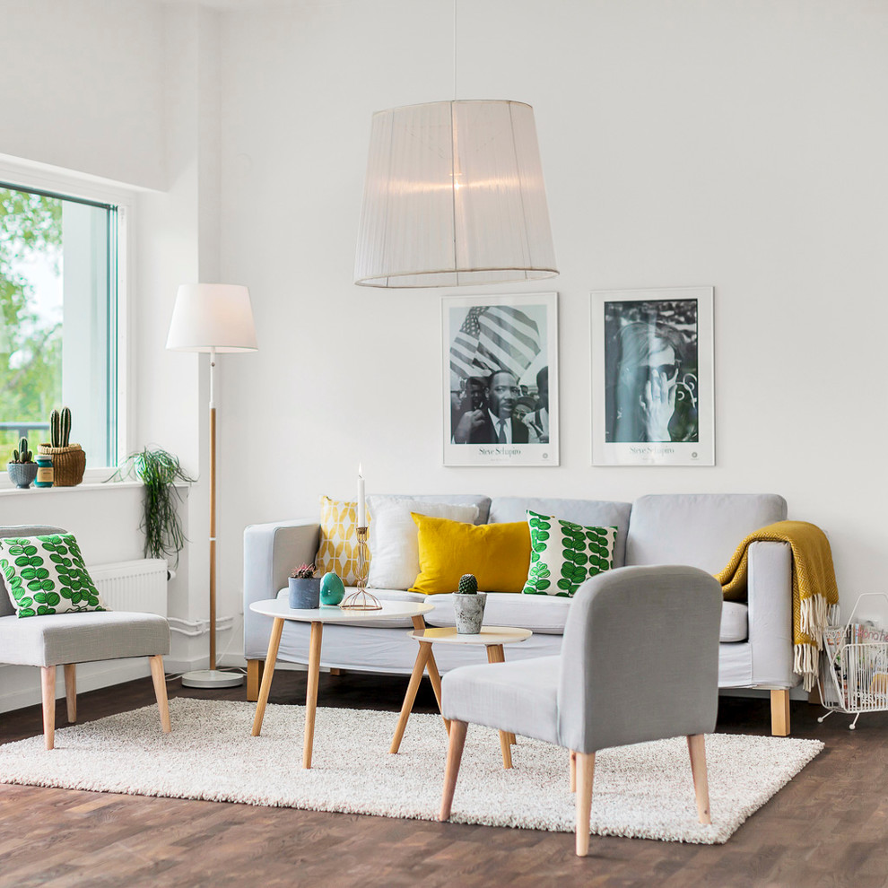 Mid-sized scandinavian formal living room in Stockholm with white walls, no fireplace, no tv and dark hardwood floors.