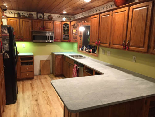 Inspiration for a mid-sized transitional u-shaped kitchen remodel with raised-panel cabinets, medium tone wood cabinets and a peninsula