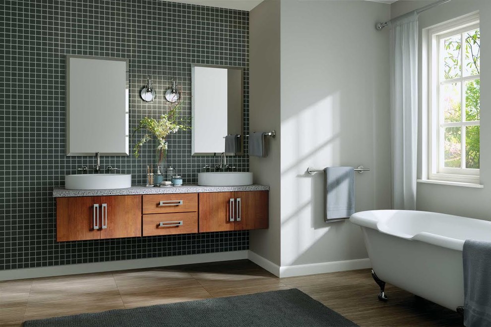 Design ideas for a large contemporary master bathroom in Other with flat-panel cabinets, medium wood cabinets, a claw-foot tub, blue tile, ceramic tile, grey walls, porcelain floors, a vessel sink, recycled glass benchtops and brown floor.
