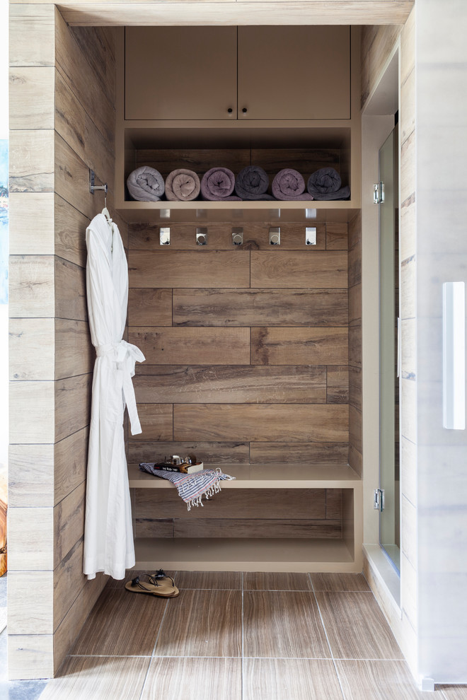 Inspiration for a small contemporary master bathroom in New York with open cabinets and a hinged shower door.