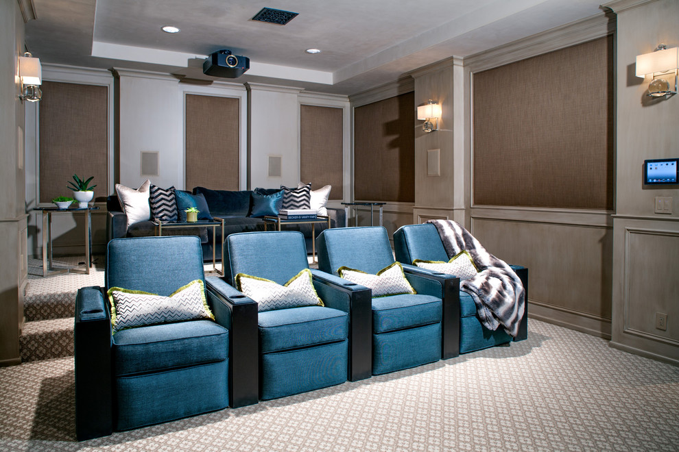Photo of a large transitional enclosed home theatre in Los Angeles with brown walls, carpet, a projector screen and multi-coloured floor.