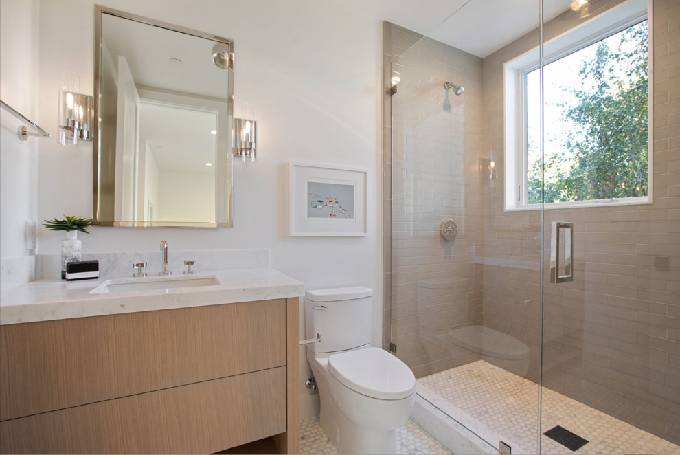 Design ideas for a mid-sized contemporary master bathroom in San Francisco with flat-panel cabinets, light wood cabinets, an alcove shower, a two-piece toilet, white walls, marble floors, an undermount sink, marble benchtops, white floor, a hinged shower door, white benchtops and gray tile.