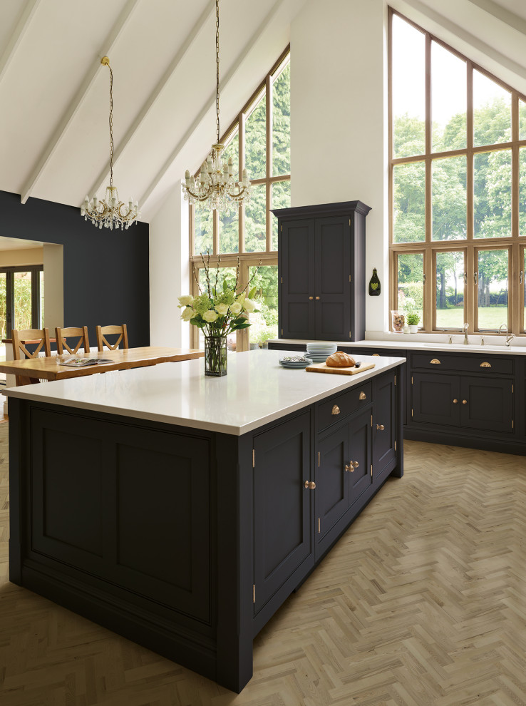 Design ideas for a large transitional l-shaped open plan kitchen in Other with shaker cabinets, purple cabinets, quartzite benchtops, stainless steel appliances, medium hardwood floors, with island, brown floor and white benchtop.