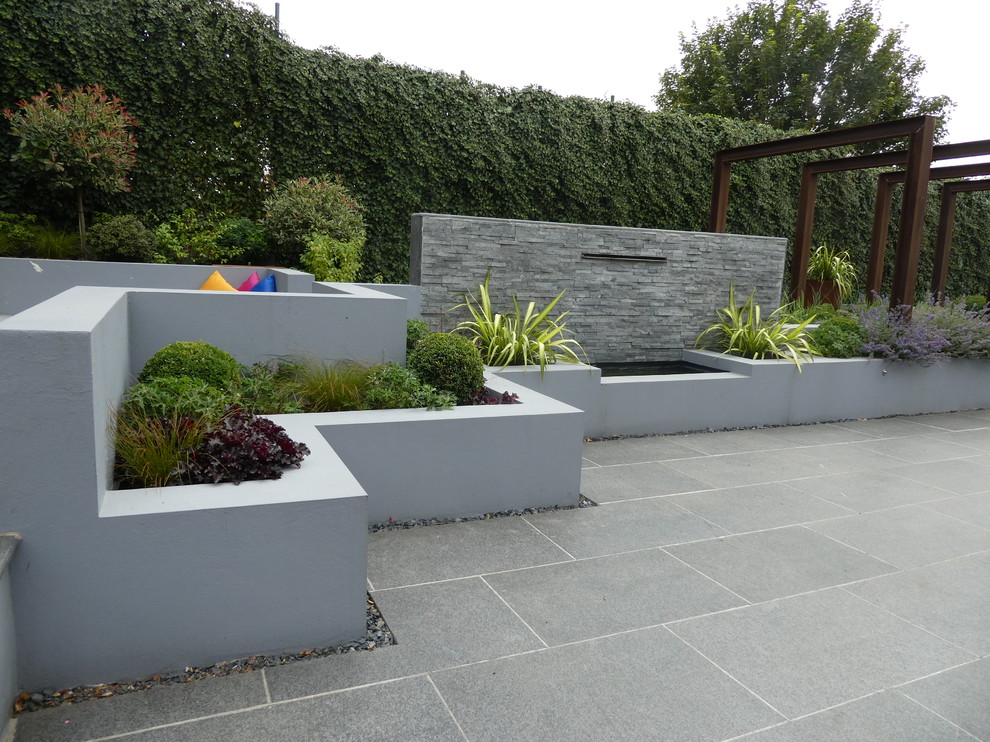 Design ideas for a large contemporary backyard garden in Cheshire.
