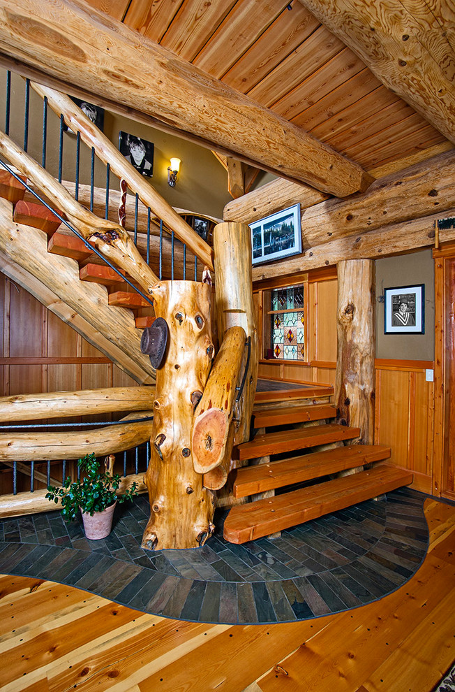 Country wood l-shaped staircase in Vancouver with open risers and mixed railing.