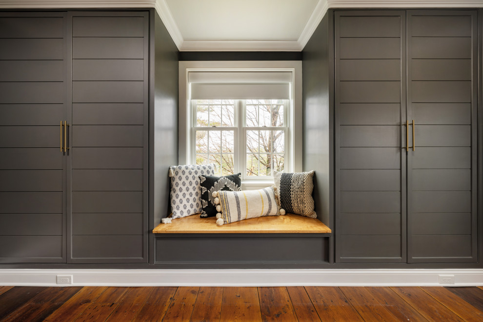 Example of a mid-sized farmhouse master medium tone wood floor and brown floor bedroom design in Philadelphia with gray walls