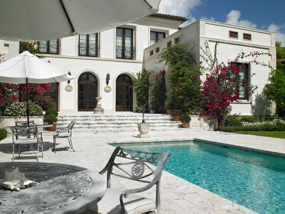 Design ideas for a mediterranean backyard rectangular pool in Miami.