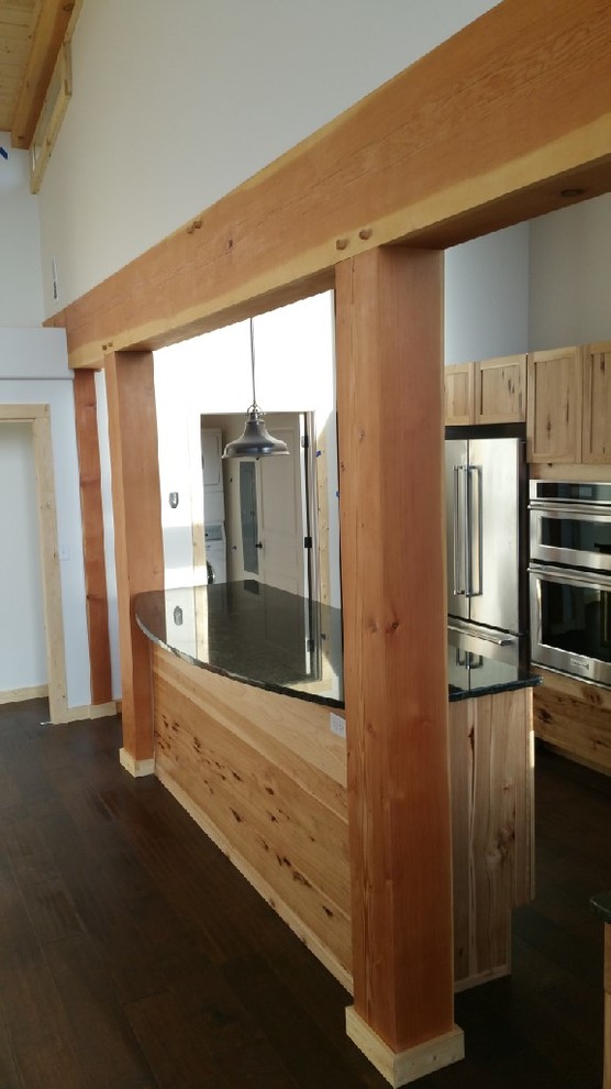 Kitchen - mid-sized rustic l-shaped dark wood floor kitchen idea in Seattle with shaker cabinets, light wood cabinets, black backsplash, stainless steel appliances and an island