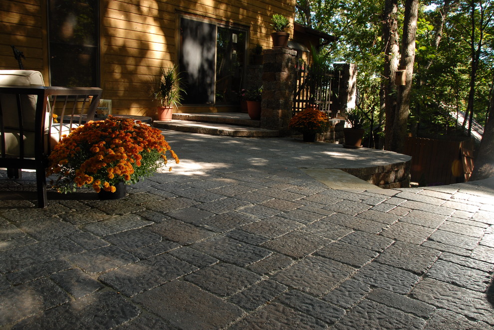 Patio - rustic backyard concrete paver patio idea