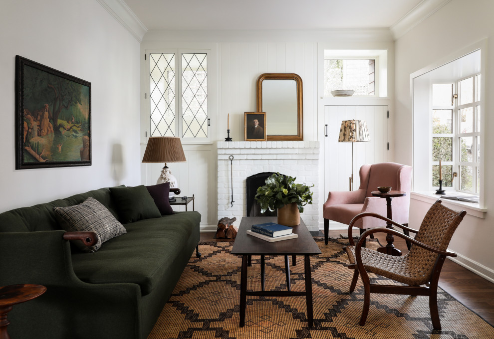 Living room - small traditional dark wood floor and brown floor living room idea in Seattle with white walls, a standard fireplace and a brick fireplace