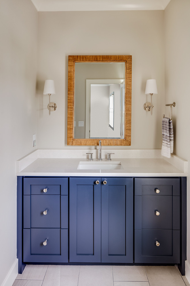 Example of a mid-sized transitional porcelain tile, beige floor and single-sink bathroom design with furniture-like cabinets, blue cabinets, beige walls, an undermount sink, quartzite countertops, white countertops and a built-in vanity