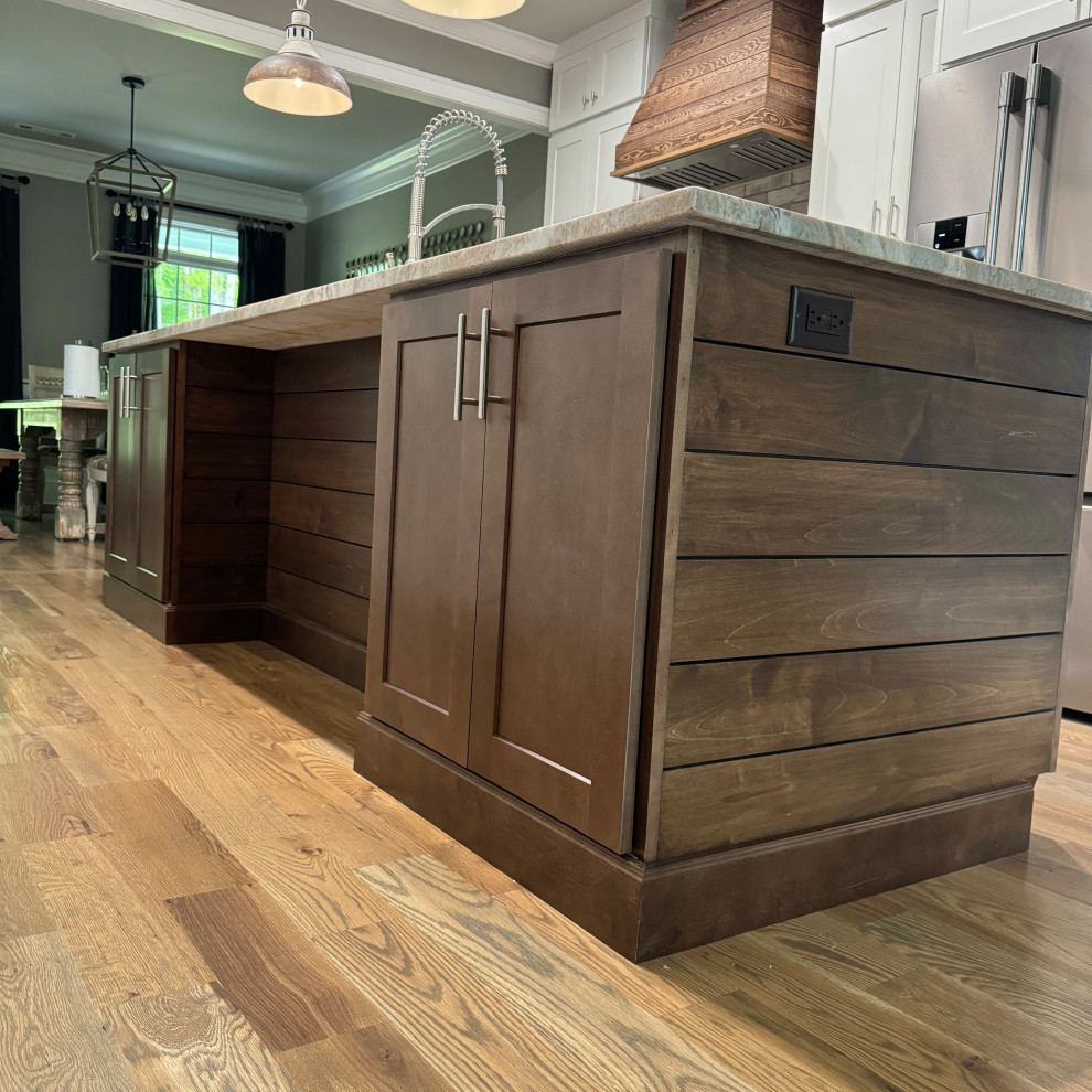 Transitional galley medium tone wood floor and brown floor eat-in kitchen photo in Atlanta with an undermount sink, shaker cabinets, white cabinets, granite countertops, gray backsplash, ceramic backsplash, stainless steel appliances, an island and multicolored countertops