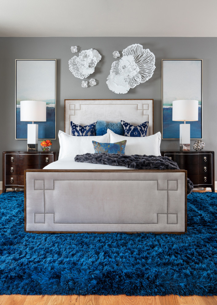Bedroom - transitional master medium tone wood floor and brown floor bedroom idea with gray walls
