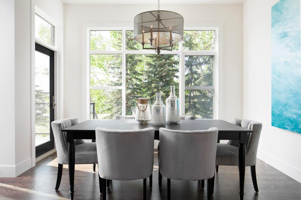Design ideas for a mid-sized transitional kitchen/dining combo in Calgary with white walls and dark hardwood floors.