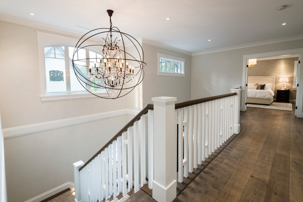 Design ideas for a large traditional hallway in Vancouver with white walls, medium hardwood floors and brown floor.