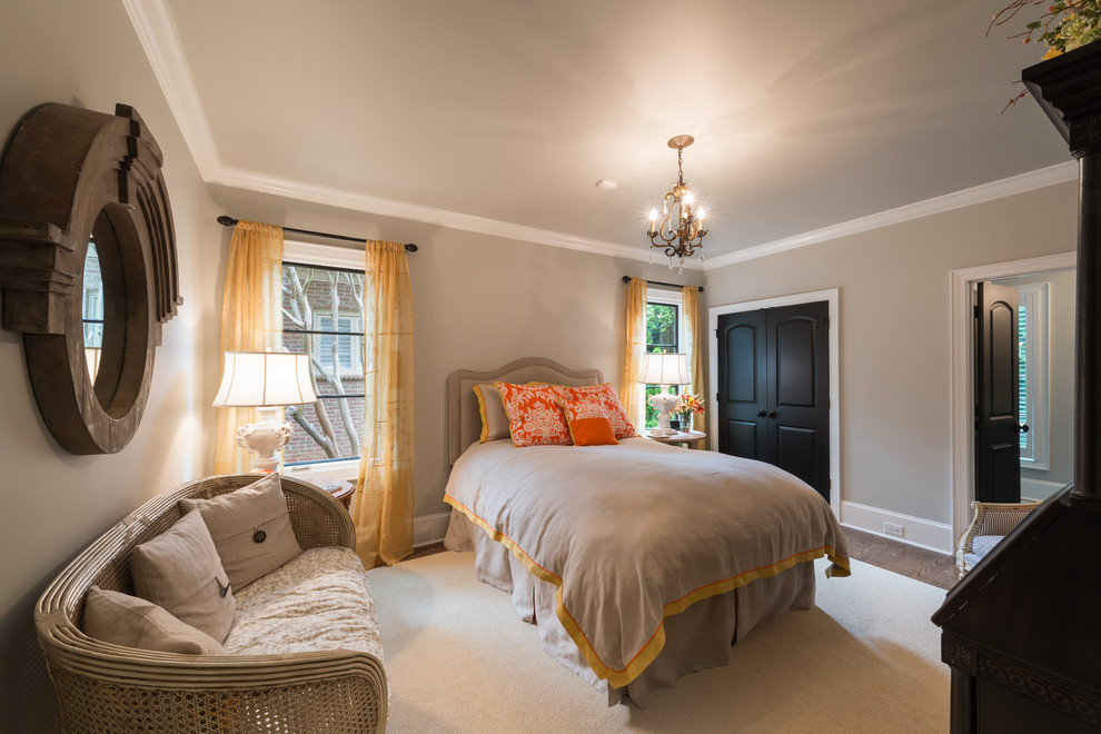 Inspiration for a traditional bedroom in Charlotte with grey walls.